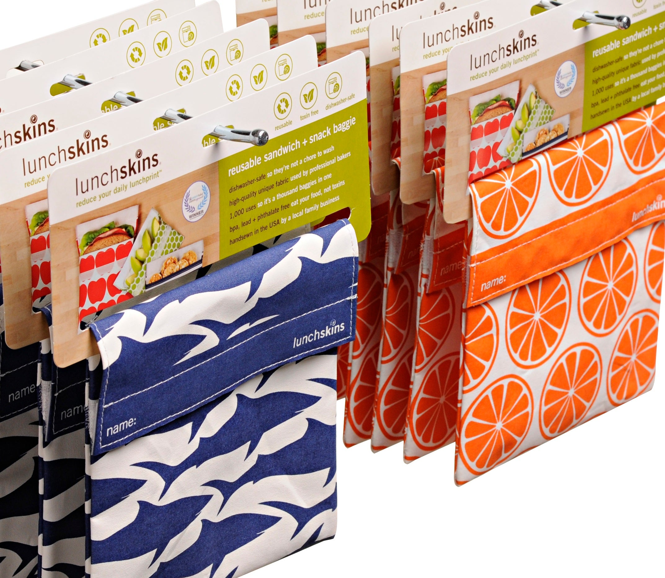 Image of Display of various patterned lunchskins bags on a rack.